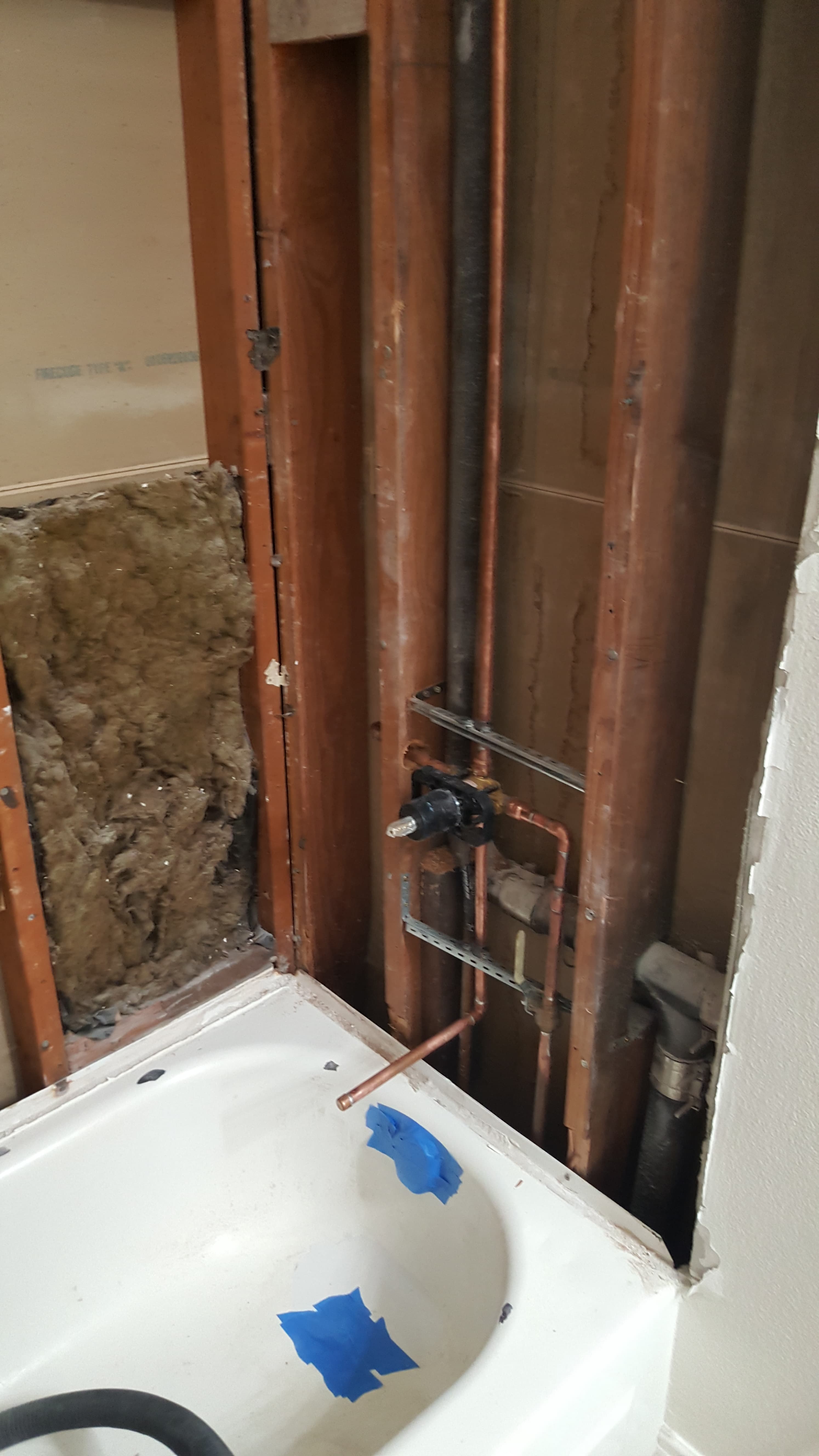 Shower and tub rough-in with copper lines and pressure-balanced valve, strapped and braced.