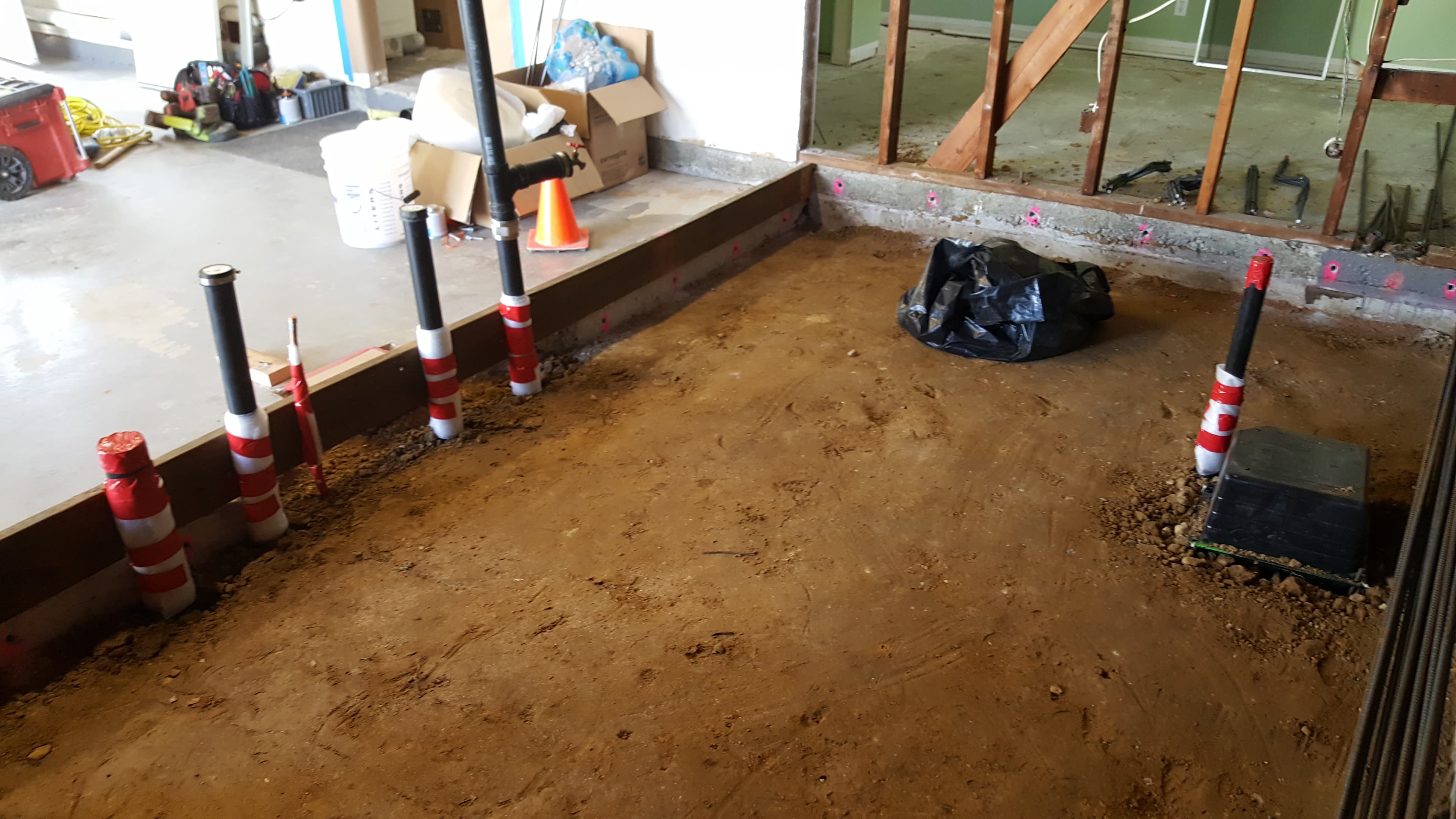 Underslab drains and vents rough-in before the slab pour.