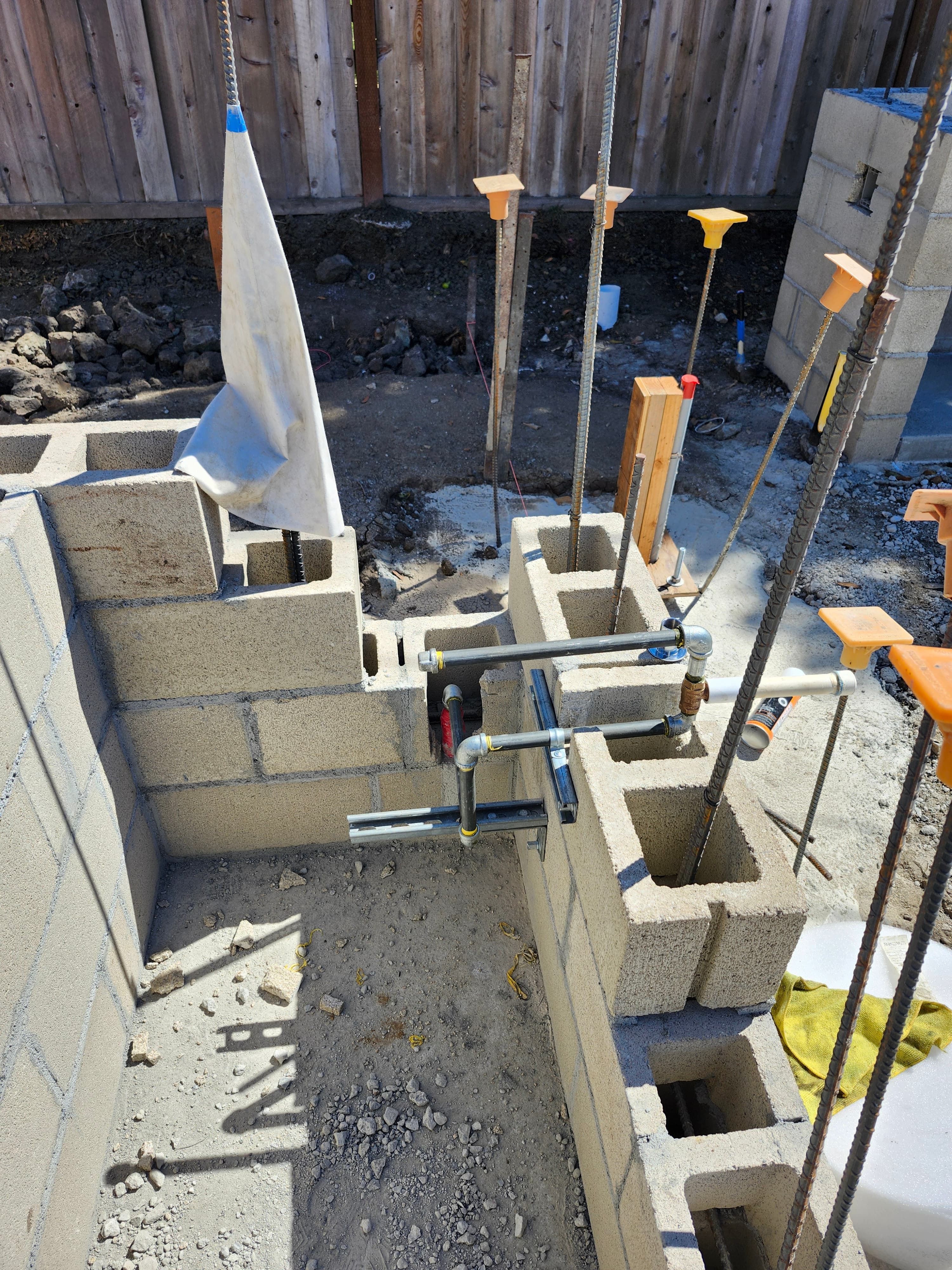 New construction gas stub-outs set in CMU wall with bracing.