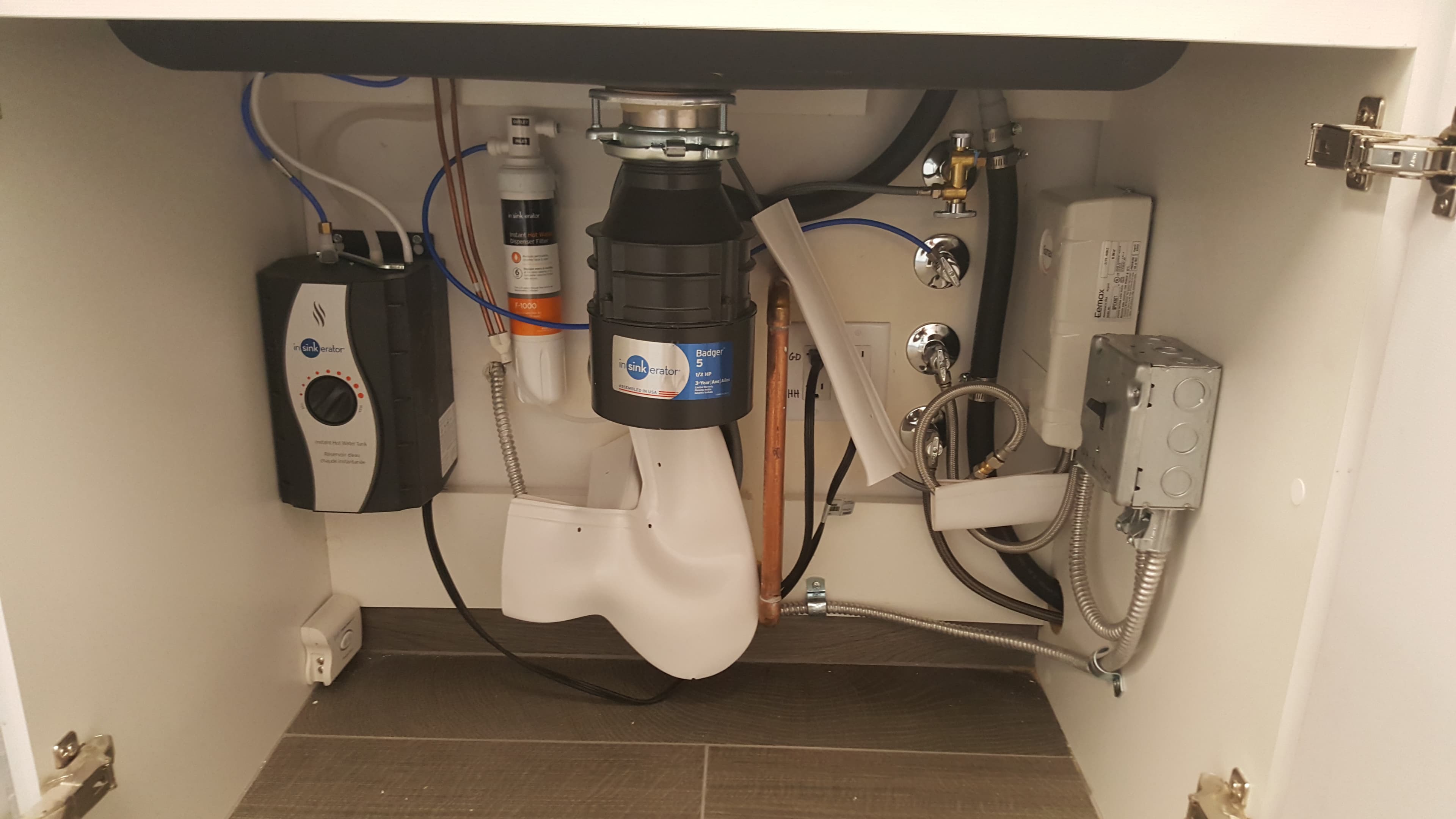 InSinkErator Badger disposal with instant hot water tank and clean shutoff layout.
